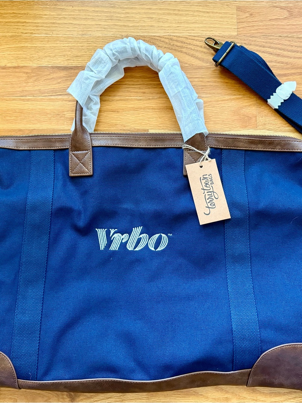 n Navy Duffel with Brown Trim in and White VRBO Logo